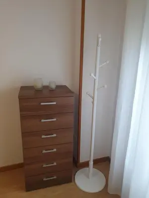 a dresser and a lamp next to a dresser at Mirasol in Viveiro