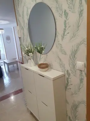 a bathroom with a mirror and a white dresser at Mirasol in Viveiro