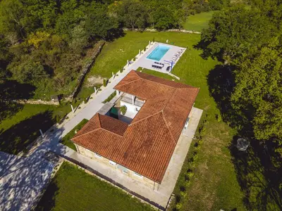 a bathroom with a glass shower and a sink at Reverence Villas Fufin in Monterroso