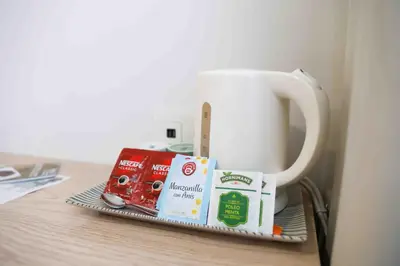 a tray with a coffee mug and some food on it at A Quinta de Cea in Cea