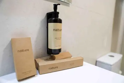 a bottle of wine sitting on a counter next to boxes at A Quinta de Cea - Apartamentos in Cea