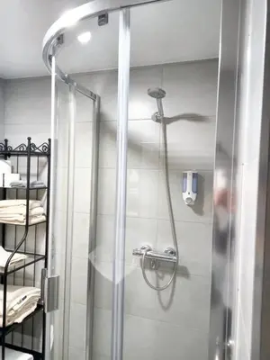 a shower with a glass door in a bathroom at Cosy Apartment with Mountain View in Mourisca - 65 sqm in Morisca