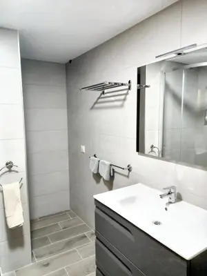 a bathroom with a sink and a mirror at Cosy Apartment with Mountain View in Mourisca - 65 sqm in Morisca