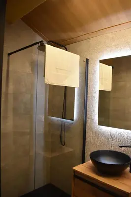 a bathroom with a glass shower with a sink at Cabana de Pili in A Estrada