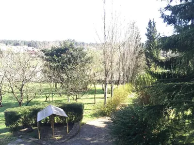 a garden with a small gazebo in the grass at Agro da Gandarela in Teo