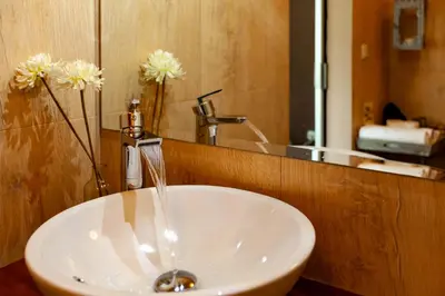 a white sink in a bathroom with a mirror at Agro da Gandarela in Teo