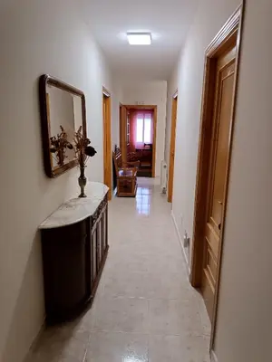 a hallway of a home with a mirror on the wall at PENSIÓN* AS VIÑAS in Puebla del Brollón