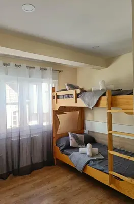 a room with two bunk beds with a window at TERRA DE AUGAS II in Caldas de Reis