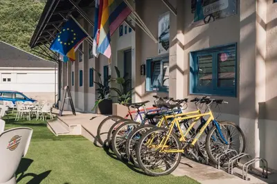 a row of bikes parked on the side of a building at Vila Vilariño Albergue Hotel & Restaurante in Ourense