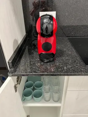 a red blender sitting on top of a counter at Apartamento con Encanto in Santiago de Compostela