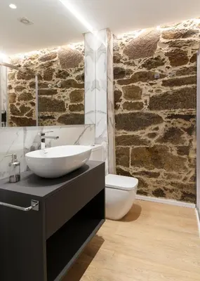a bathroom with a sink and a toilet at Ribeira Sacra a Orilla Rio Miño Casas do Pincelo in Pincelo