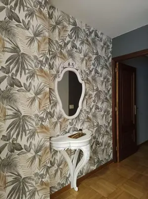 a bathroom with a sink and a mirror on a wall at Vivienda Arias in Carballino