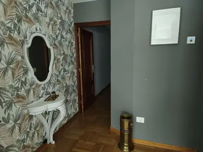 a bathroom with a sink and a mirror on a wall at Vivienda Arias in Carballino