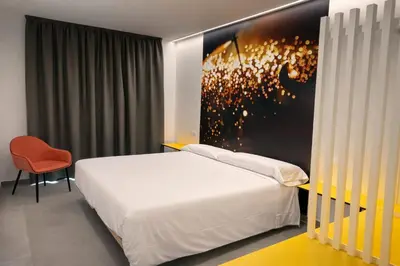 a hotel room with a bed and a couch at Pension Sarria in Sarria
