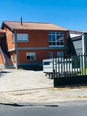 a house with a white truck parked in front of it at Casa Aricel VT in Chantada