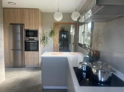 a kitchen with two pots on top of a counter at Apartamento en Barreiros in San Miguel de Reinante