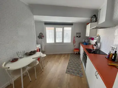a kitchen with a table and chairs in a room at Campo de la Compañía in Monforte de Lemos