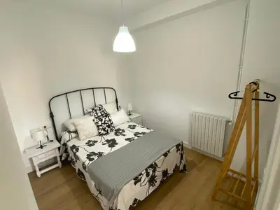 a bedroom with a bed and a lamp and a ladder at Campo de la Compañía in Monforte de Lemos