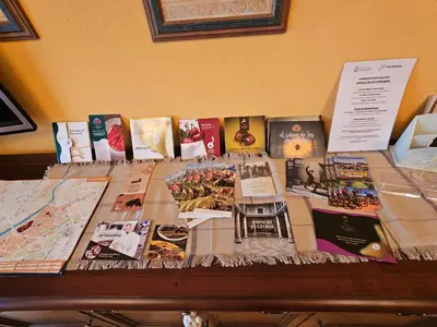 a table with many books on it at Duplex Casa Camino in Ponferrada