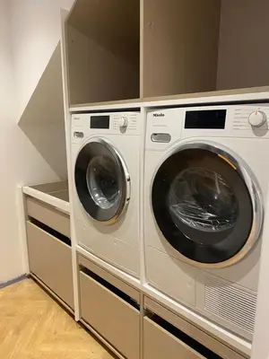 two washing machines are in a laundry room at oh la life! at the top in Santiago de Compostela