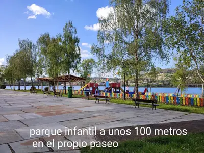 an empty park with a playground and a play area at O Paseo, 5 estrellas. in Puentedeume
