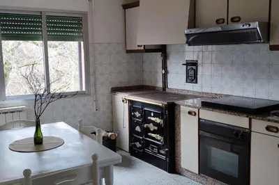 a kitchen with a table and a counter top at Casa Cuco in Corejido