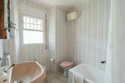 a bathroom with a tub and a toilet and a sink at Casa Cuco in Corejido