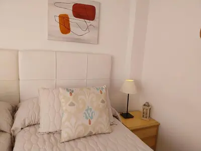 a bedroom with a bed with a pillow on it at Solerma in Viveiro