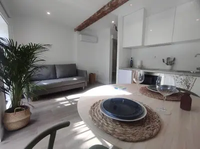 a living room with a table with two wine glasses at Lepanto3 - Apartamento amplio y luminoso para disfrutar de Ourense in Ourense