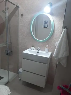 a bathroom with a sink and a mirror at Apartamento En Camino - Milladoiro in Milladoiro