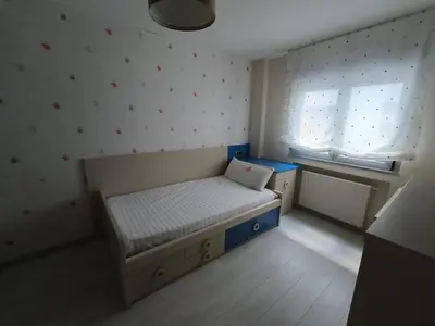a small bedroom with a bed and a window at Castrelo 4A in Burela de Cabo