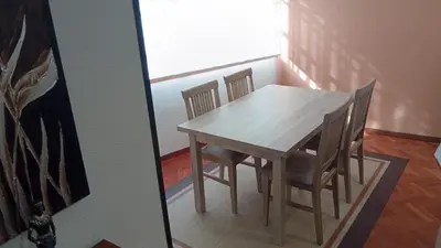 a dining room table and chairs in a room at Pontedeume cerca del mar y la naturaleza in Puentedeume