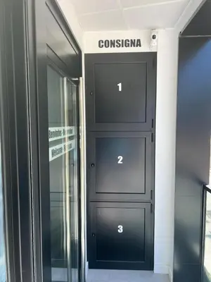 a black door with the name of a building at O Albergue de Fene in Fene