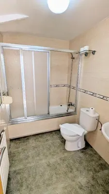a bathroom with a toilet and a shower and a sink at Restaurante y Hostal San Paio in Santiago de Compostela