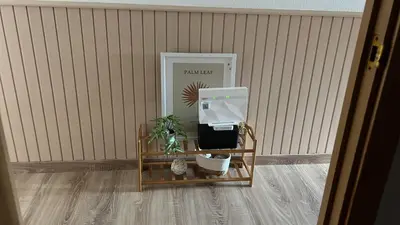 a soap dispenser sitting on a table next to a wall at APARTAMENTO FOZ Imr in Foz