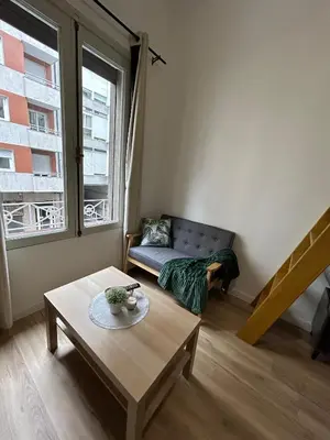 a living room with a couch and a table at Catapiriño - Confort Elegante y Exclusivo en el Corazón de la Ciudad in Ourense