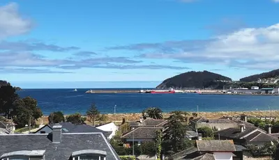 a view of the ocean from a residential neighbourhood at Sobre la Playa in Covas