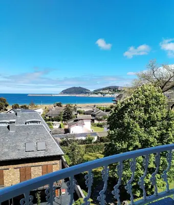 a view of the ocean from the balcony of a house at Sobre la Playa in Covas