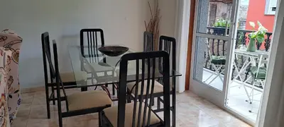 a dining room with a glass table and chairs at Casa Castrexa in Novoa