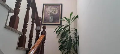 a picture of a flower in a vase on a staircase at Casa Castrexa in Novoa