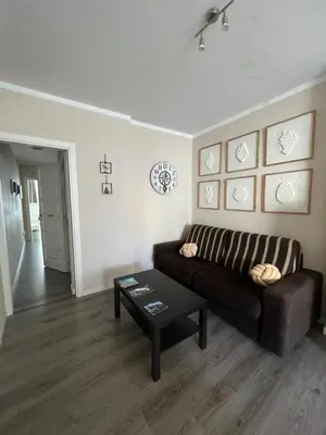 a living room with a couch and a coffee table at Cuatro Calles Picarolas in Ribadeo