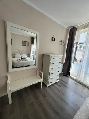 a bedroom with a white dresser and a large mirror at Cuatro Calles Picarolas in Ribadeo