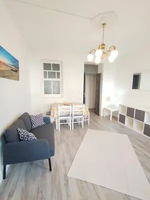 a living room with a couch and a table at Yellow House in Viveiro