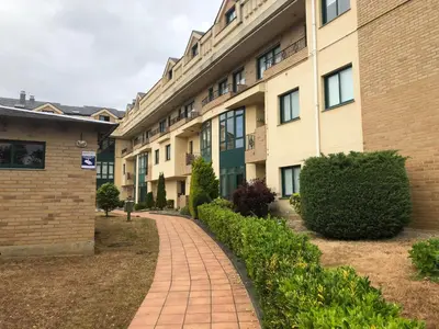 a brick walkway in front of a building at O xualtar Océano 2 in Villadaíde