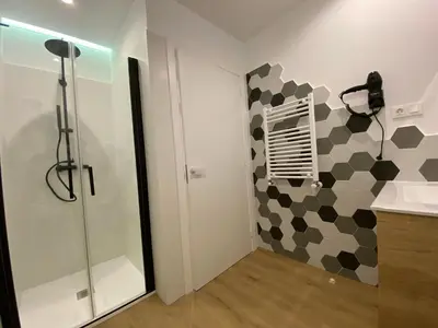 a bathroom with a shower and a sink at Casa das Indias in Ribadeo