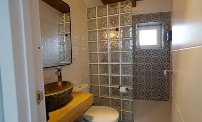 a bathroom with a sink and a toilet at CASA DO XASTRE in Arnego