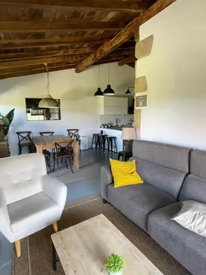 a living room with a couch and a table at CASA DO XASTRE in Arnego
