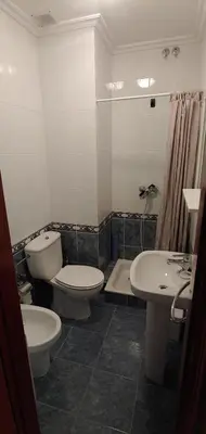 a bathroom with a toilet and a sink at Casa o Pontillón in Rabiño