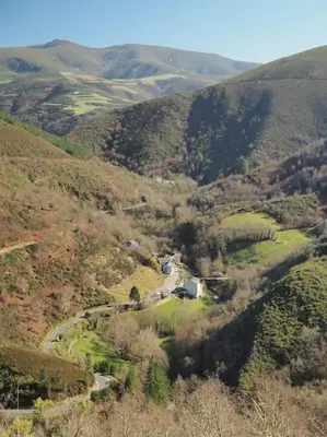 a view of a mountain with a house and a road at O Recuncho de Doiras in Ferreiravedés