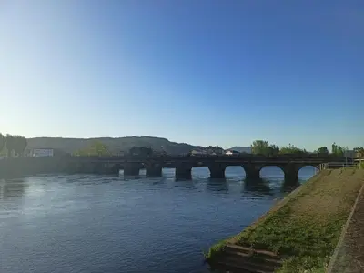 a bridge over a river with a train on it at Cesuresrooms2 in Puentecesures
